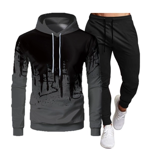 Detail of men's casual tracksuit featuring a black grey gradient ink splash hoodie and joggers