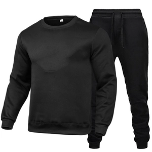 Detail of black crewneck sweatshirt and matching drawstring joggers set in flat lay view