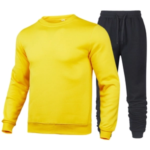 Detail view of yellow crewneck sweatshirt with ribbed cuffs and black drawstring joggers