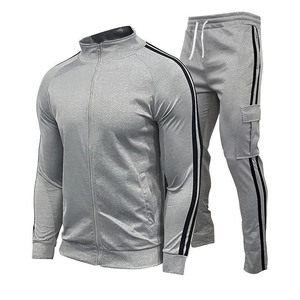 Men's casual grey tracksuit set featuring zip-up stand collar jacket and striped joggers