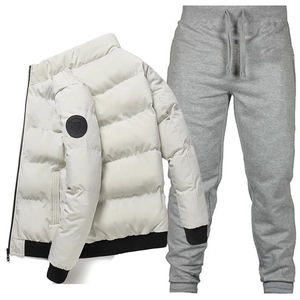 Detail of cream puffer jacket with tiger patch and grey drawstring joggers set