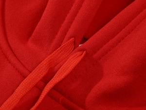Close-up of red hoodie neckline with heavy knit fabric and flat drawstring details