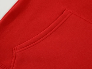 Detailed macro view of reinforced double-needle stitching on red hoodie kangaroo pocket