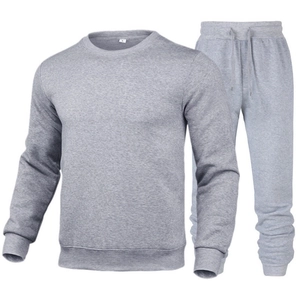 Men's grey crewneck sweatshirt and joggers set in minimalist soft knit cotton fabric