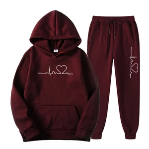 Detailed view of burgundy fleece tracksuit with heart line print and drawstring hoodie