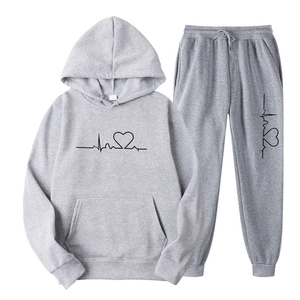 Detail of grey hooded tracksuit set with heart rate pattern and adjustable drawstring