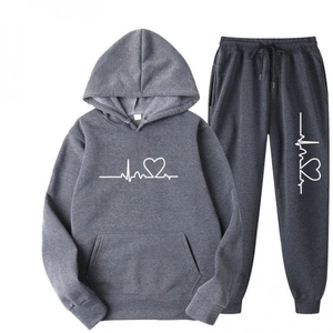 Flat lay of dark grey hoodie set featuring white heartbeat graphic and kangaroo pocket