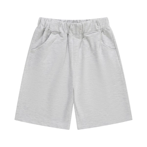 Detail of light grey kids sports shorts showing elastic waistband and knitted texture