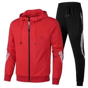 Detail of red hooded sports jacket and black joggers with white stripe trim