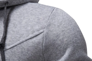 Detail of grey hoodie shoulder stitching and premium knitted fabric texture on cotton blend