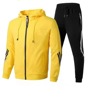 Two-piece sports set featuring yellow hooded jacket and black jogger pants with side stripes