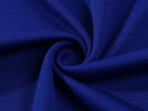 Macro shot of breathable royal blue pique fabric texture for men's polo shirt