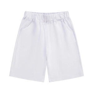 Detail of white children's sports shorts featuring elastic waistband and soft knit fabric