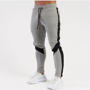 Men's slim fit light grey joggers with black side stripes and drawstring waistband