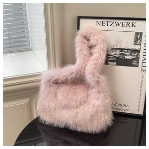 Detail of pink faux fur tote bag with soft plush texture and ring handle structure