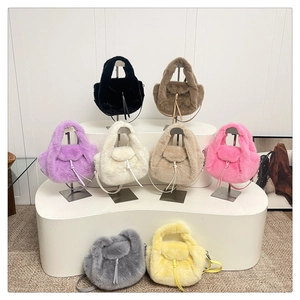 Detailed display of plush faux fur handbags in eight colors with drawstring closure