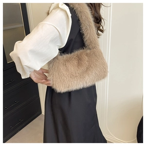Detail showing the fluffy khaki faux fur texture and long strap of this soft tote bag