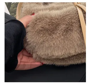 Detailed macro view of the fluffy faux fur texture and leather strap on the plush handbag