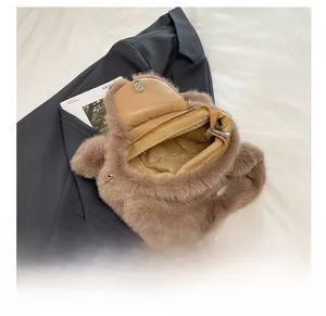 Detail view of the brown plush bag showing magnetic closure and soft faux fur texture
