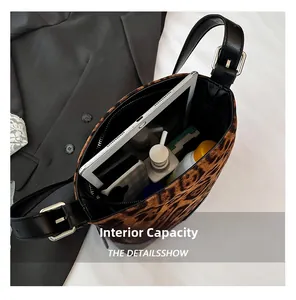 Leopard print bucket bag interior showing large capacity for tablet and cosmetics