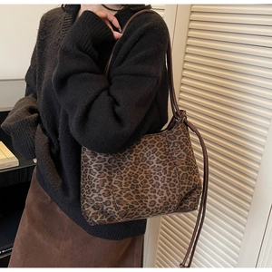 Detailed view of vintage leopard print hobo bag with slim double shoulder straps