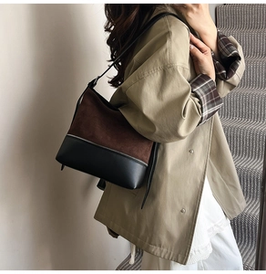 Detail of the suede leopard print shoulder bag showing brown and black material textures