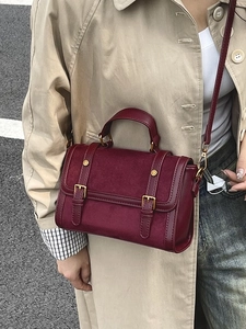 Vintage burgundy crossbody bag with mixed leather textures and golden metallic hardware
