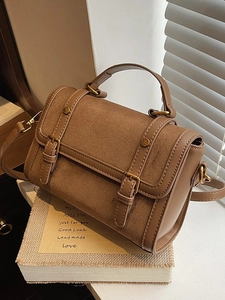 Vintage brown patchwork crossbody bag with textured suede and smooth leather finishes