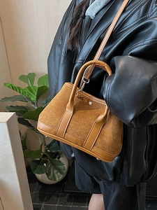 Retro brown suede bucket bag with leather trim and shoulder strap for women