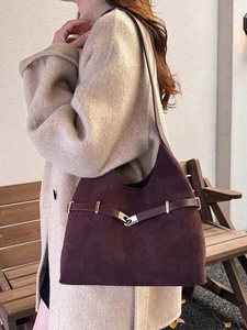 Retro deep purple suede tote bag with brown leather straps shown on a model