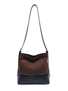 Vintage leopard faux suede bucket bag in two-tone brown and black with silver zipper detail