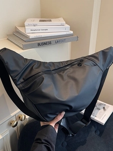Minimalist black large capacity shoulder bag made of waterproof nylon with logo label