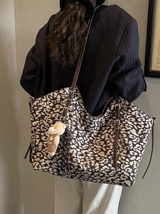 Retro leopard print tote bag with brown leather straps and small bear charm