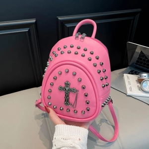 Pink PU leather backpack with silver rivets and vintage cross pendant detail