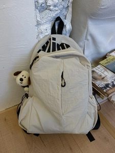 Mochila beige minimalista impermeable gran capacidad con peluche de perro lindo