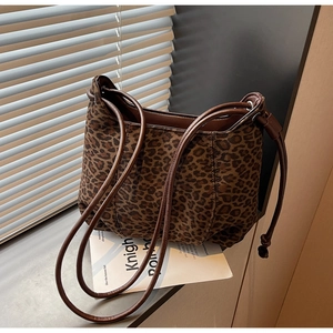 Detail of leopard print tote bag with soft texture and double slim shoulder straps