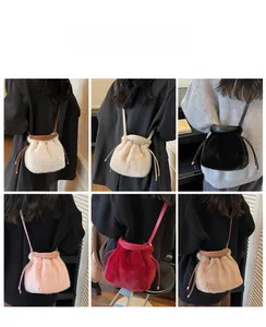 Faux fur drawstring bucket bags displayed in six colors on models for a textured look