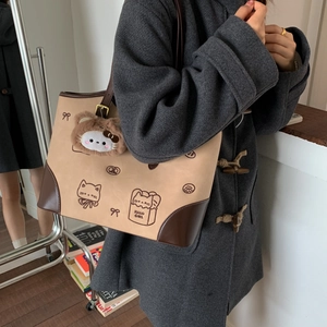 Large khaki tote bag with cartoon cat print and plush pendant for casual daily wear