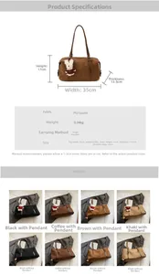 Detail view of large faux suede tote bag featuring a cute red bunny plush charm accessory