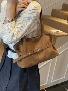 Brown faux suede tote bag for women with decorative buckle belt and long shoulder strap
