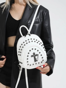 White mini backpack with metal studs and gothic cross detail in streetwear style