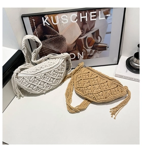 Detail of bohemian hand-woven saddle bag with intricate cotton rope texture and side tassels