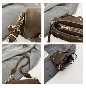 Dettaglio degli accessori dorati e della tracolla intrecciata della borsa marrone