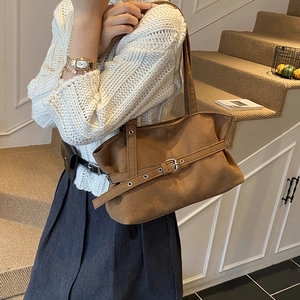 Brown vintage suede tote bag with decorative buckle for women in daily commute