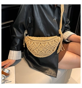 Detailed view of hand-woven bohemian waist bag with geometric patterns and fringe tassels