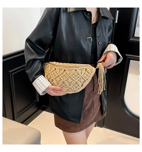 Detail of beige macramé waist bag featuring geometric patterns and side tassels