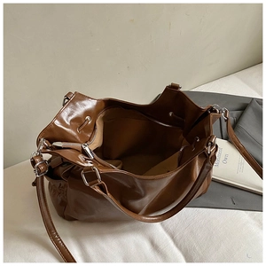 Detailed interior of caramel oil wax leather tote bag with metal zipper and inner pocket