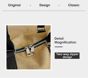 Close-up of durable two-way metal zippers on a brown canvas travel duffel bag