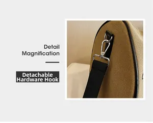 Detail magnification of detachable silver hardware hook and canvas bag strap