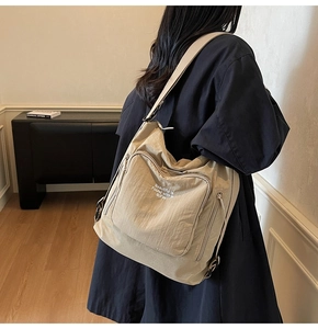 Khaki large capacity tote bag with adjustable strap and BIFW white lettering print